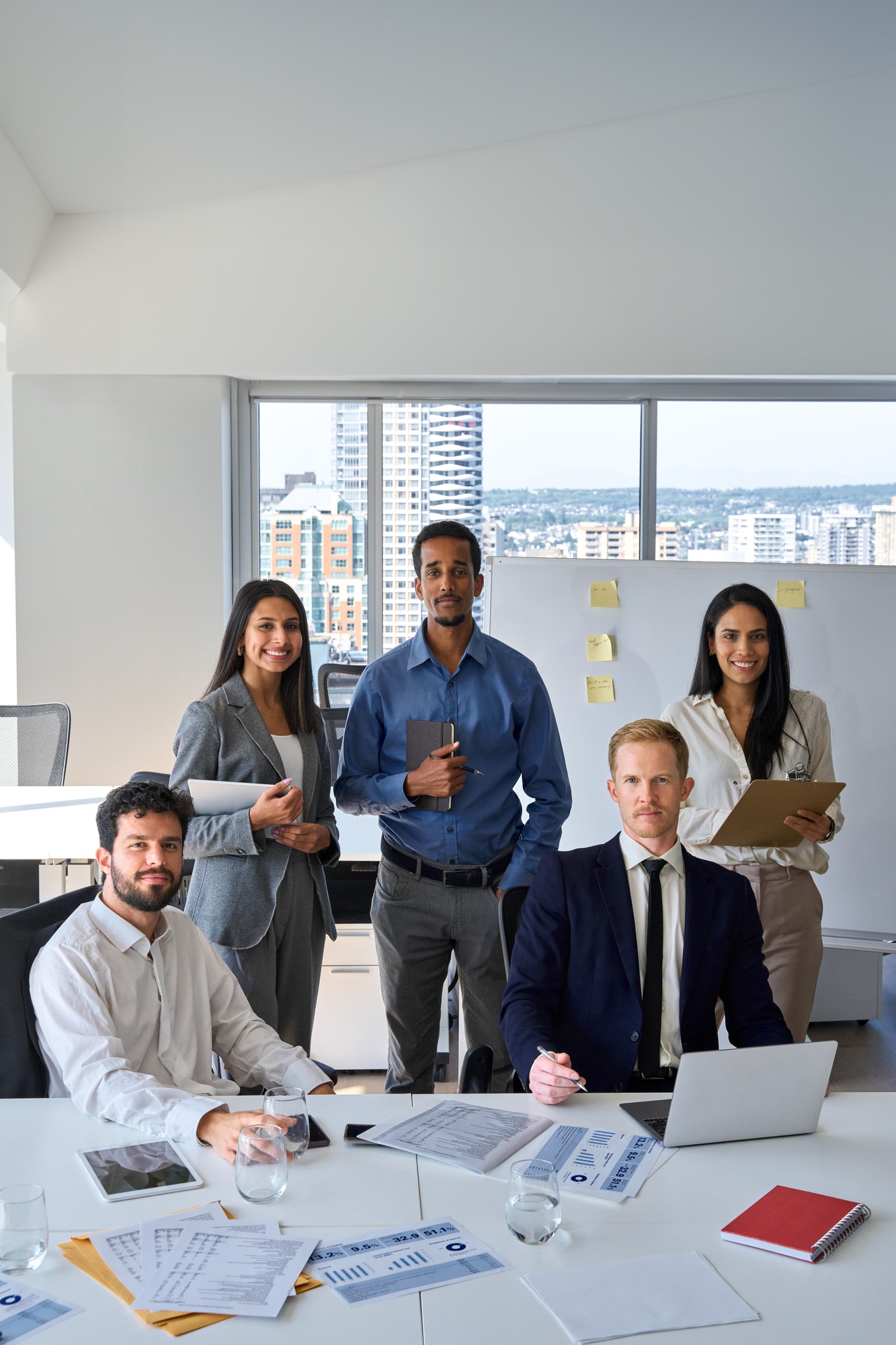 Professional diverse team business people in office boardroom. Vertical portrait