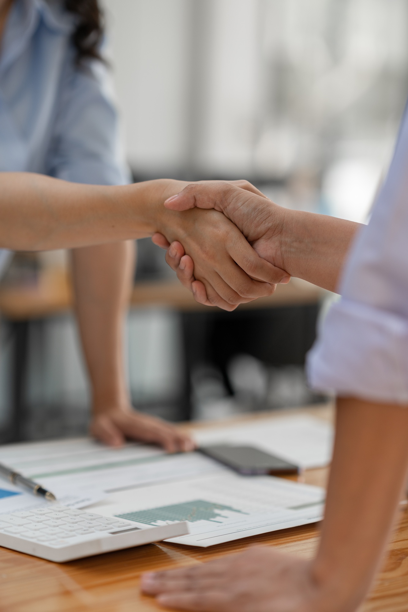 Two businesswoman shaking hands for success. Handshake. Collaboration, teamwork, friendship. Meeting